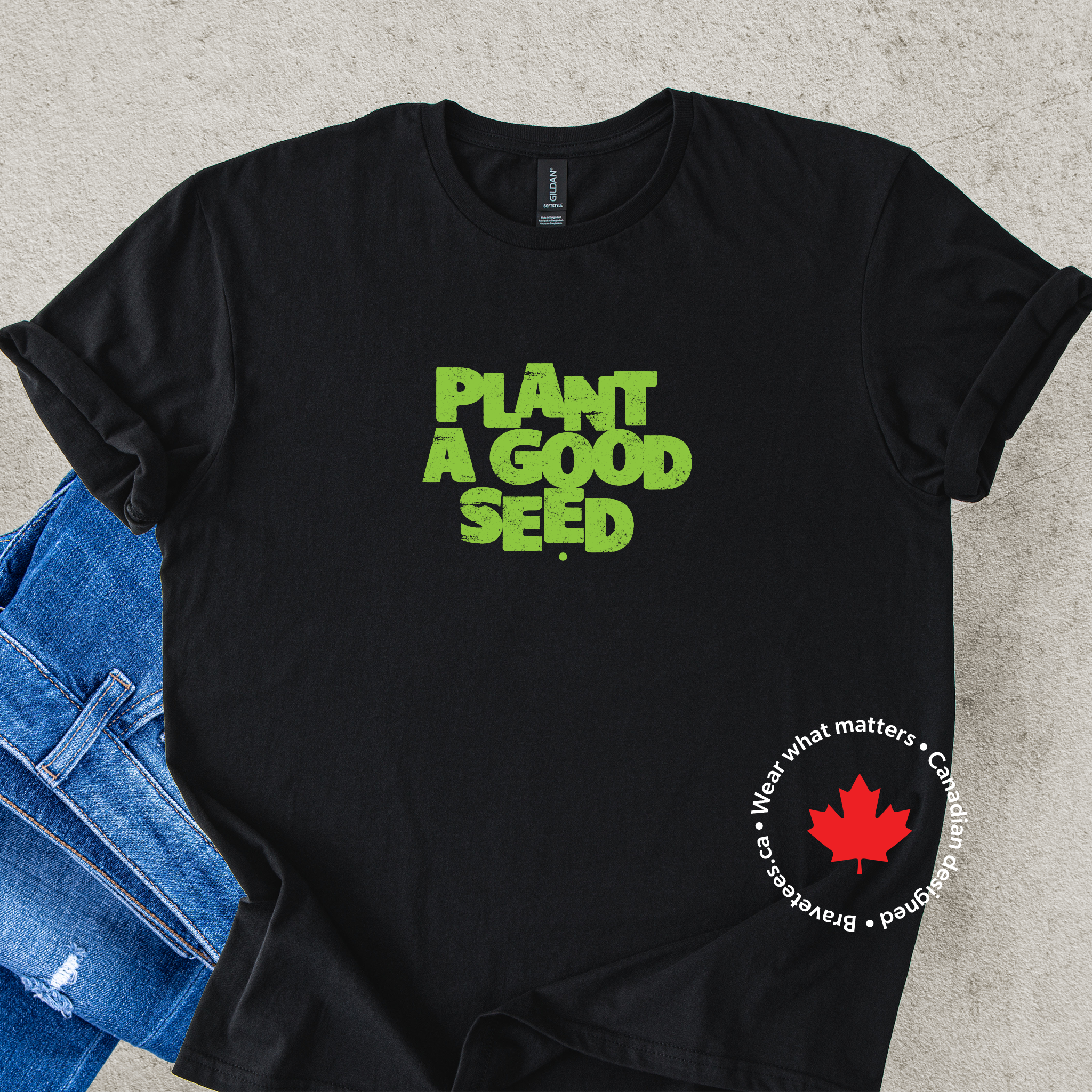 'Plant a Good Seed' green text on a black t-shirt