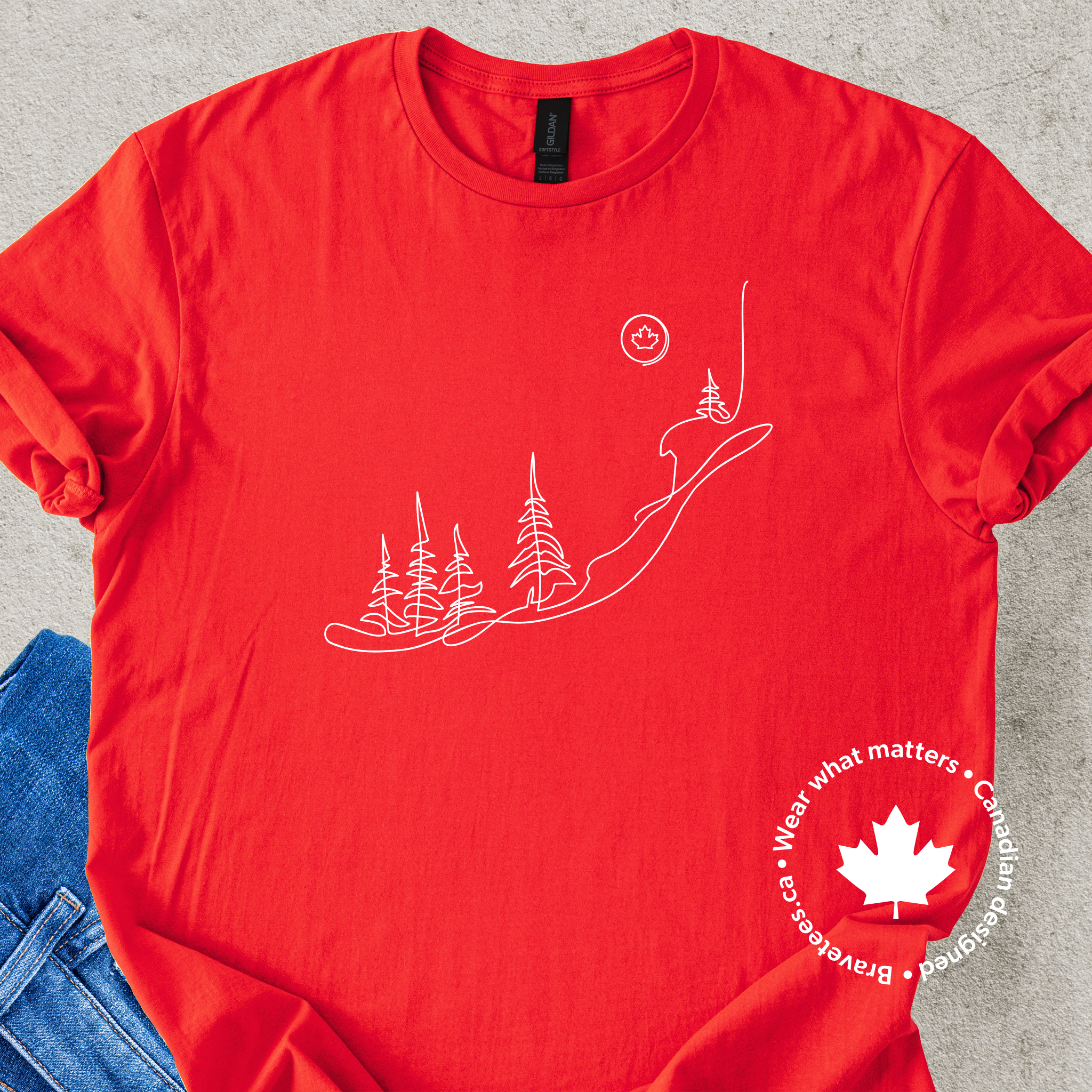 Red t-shirt  with nature-themed design and Canadian maple leaf