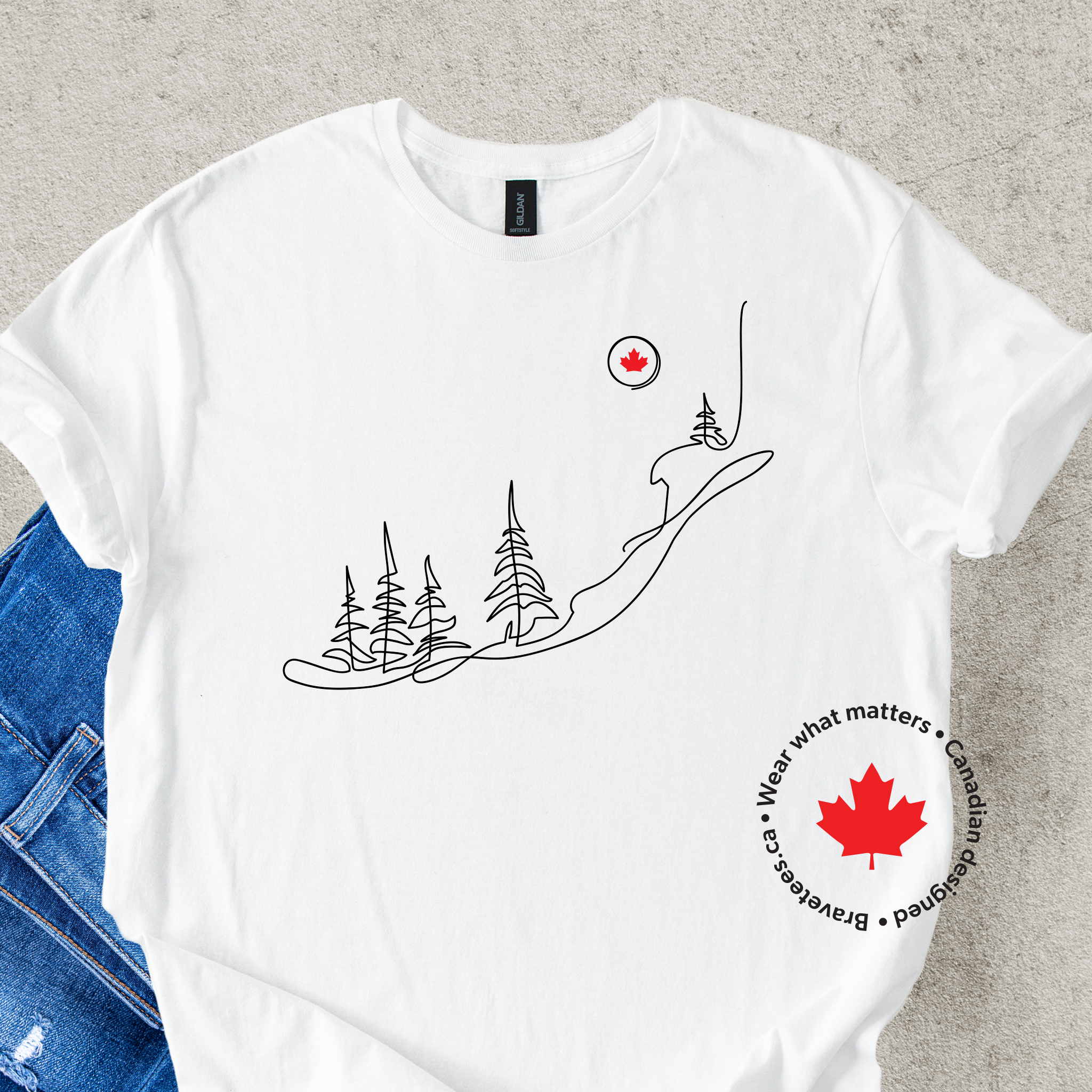 White t-shirt with nature-themed design and Canadian maple leaf