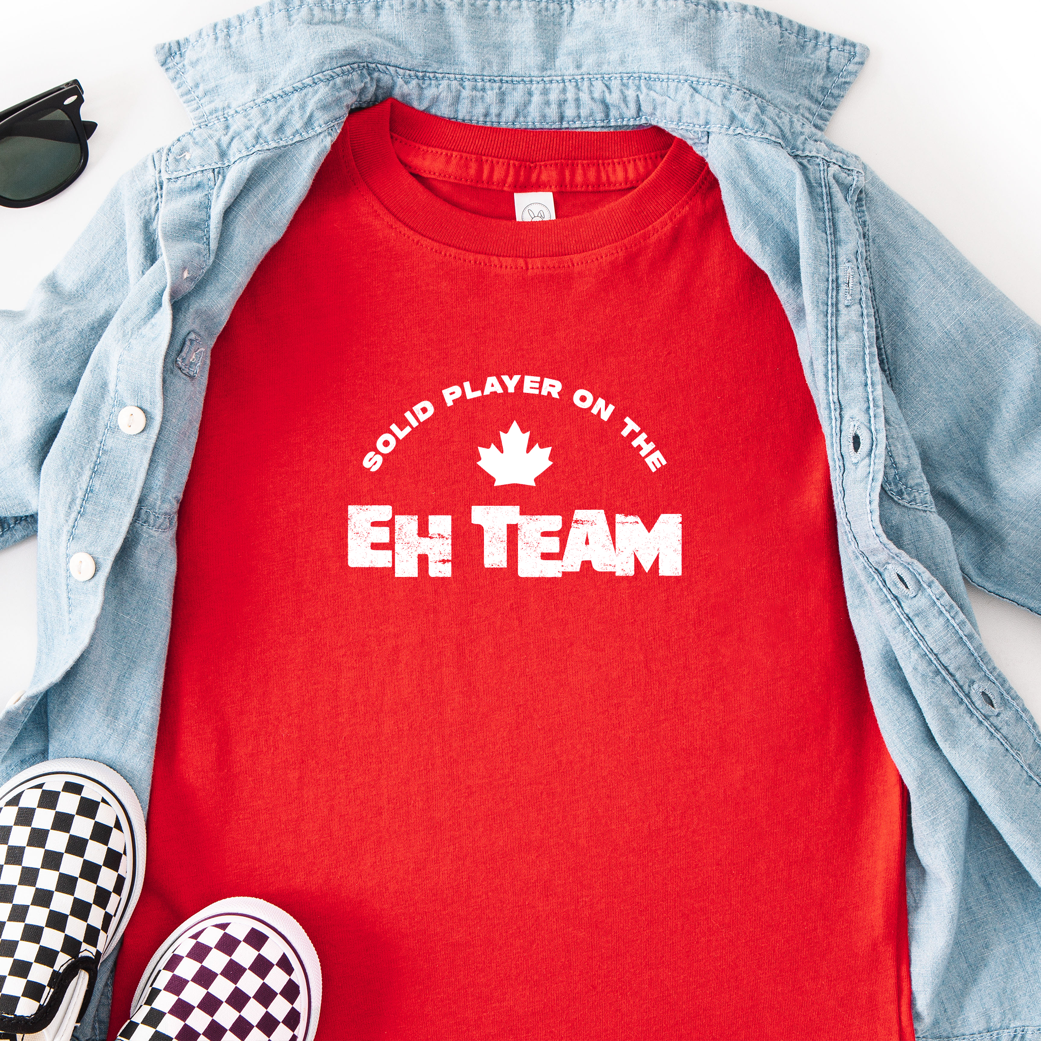 'Solid Player on the EH Team' text on a toddler t-shirt in red